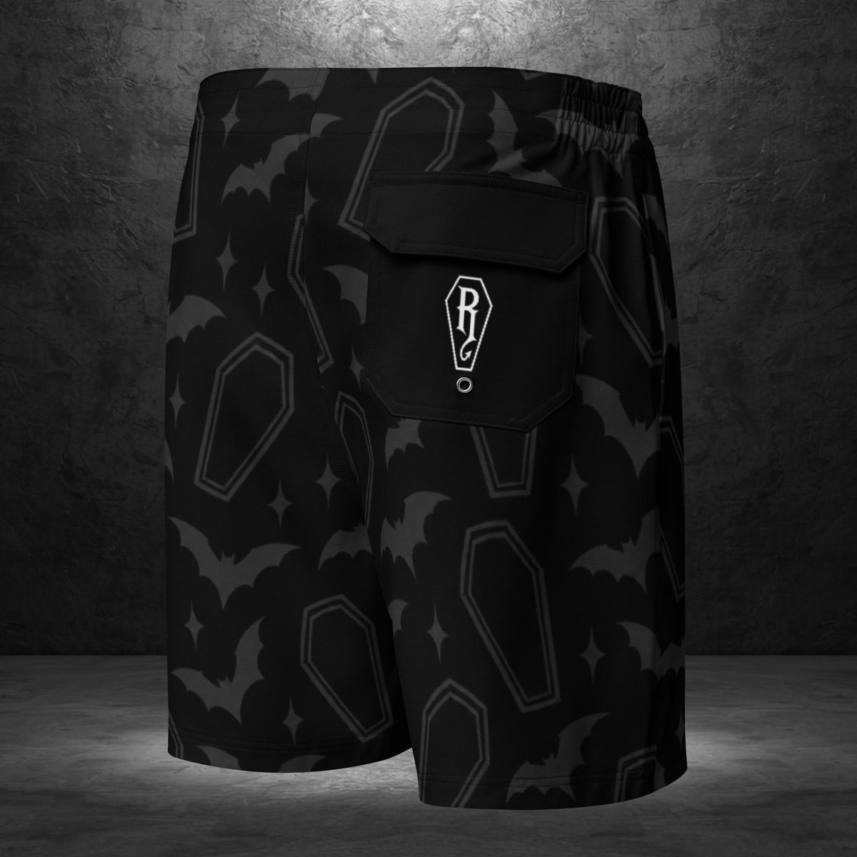 Ryot Ink black board shorts back view showing rear flap pocket and swimwear design